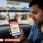 A car passing through an electronic highway toll plaza with active FASTag verification