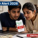 Indian currency note next to a phone screen showing bank account balance and loan EMI deduction alert